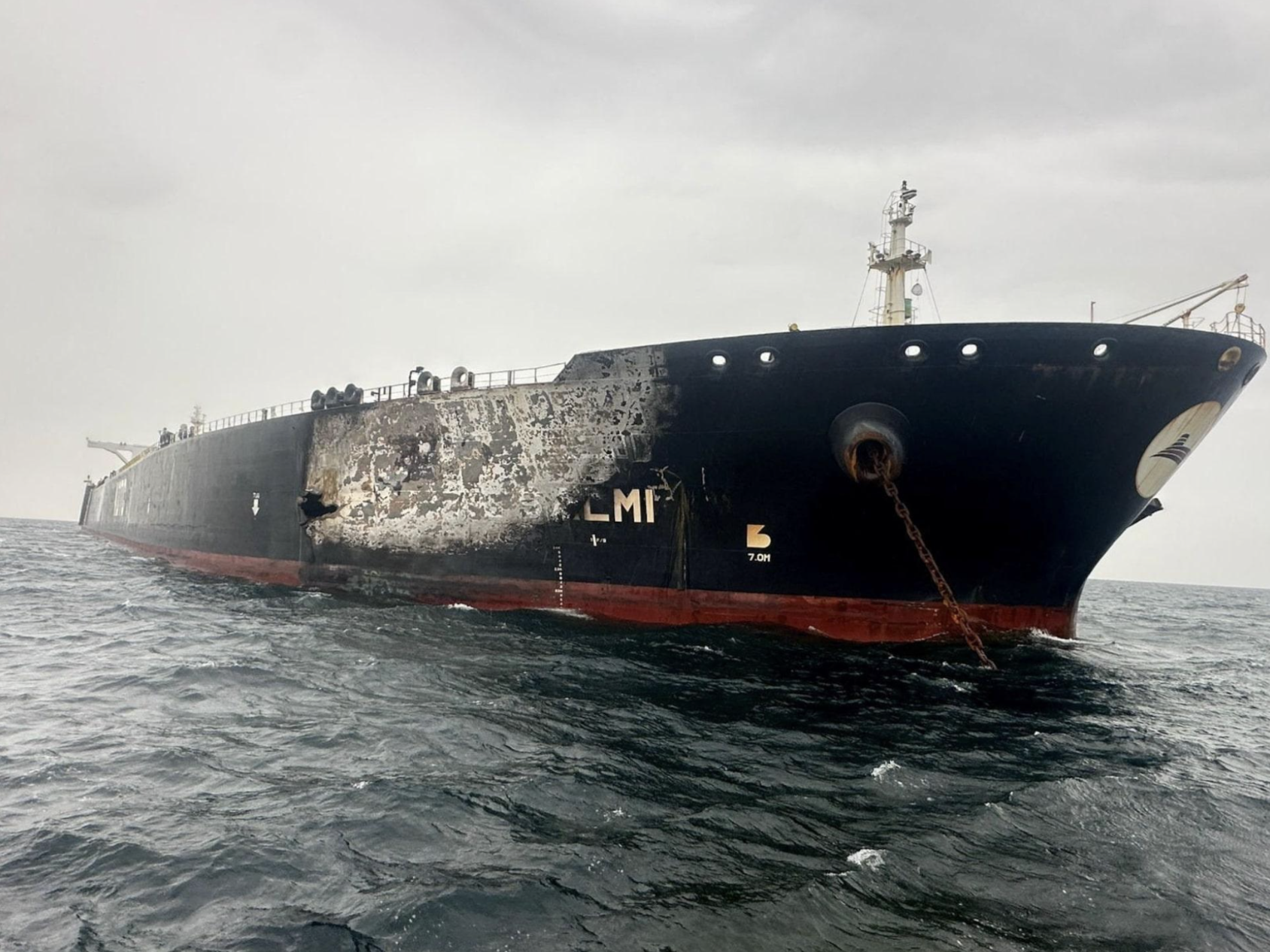 A damaged oil tanker near the Strait of Hormuz. Brent traded above $100 as US-Iran strikes entered a 13th night. Source: Reuters.
