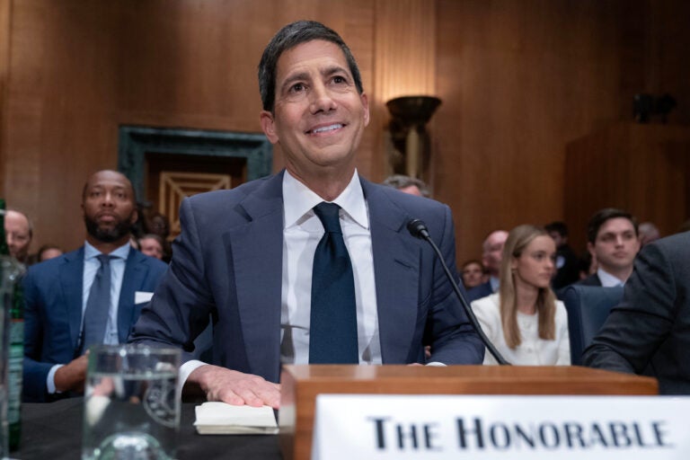 Kevin Warsh. Sworn in two weeks ago; his first FOMC June 16-17 lands on a labor print that invalidated the cut-trade and an oil tape still wired to Hormuz. The vol surface has priced him patient — not a posture the print supports. Source: WHYY — Senate confirms Warsh as Fed Chair
